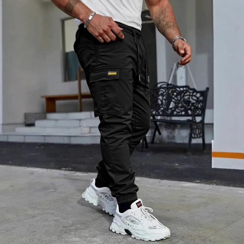 👖50 % RABATT🏃 Arbetsbyxor i fleece | Dragsko i midjan · Slitstarkt polyester · Avsmalnande ben · Flera fickor