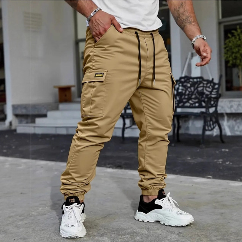 👖50 % RABATT🏃 Arbetsbyxor i fleece | Dragsko i midjan · Slitstarkt polyester · Avsmalnande ben · Flera fickor