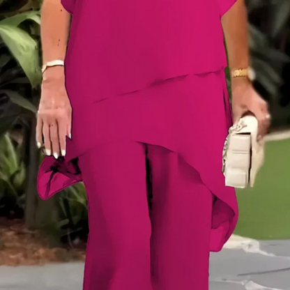 Damset i två delar: Snygg asymmetrisk topp och vida byxor