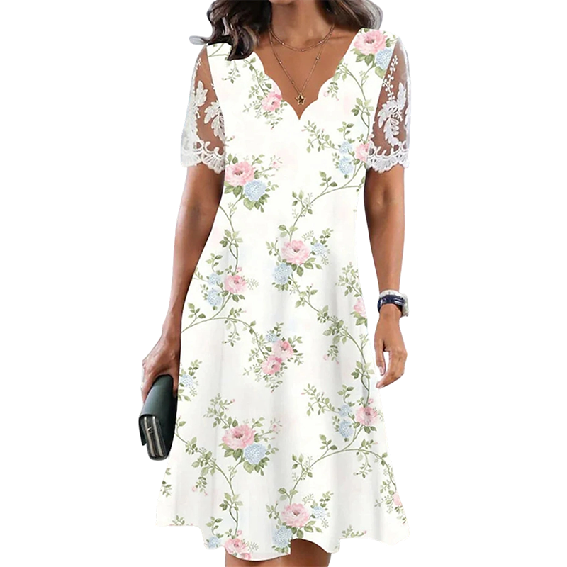 Damklänning med blommönster och spetsärmar